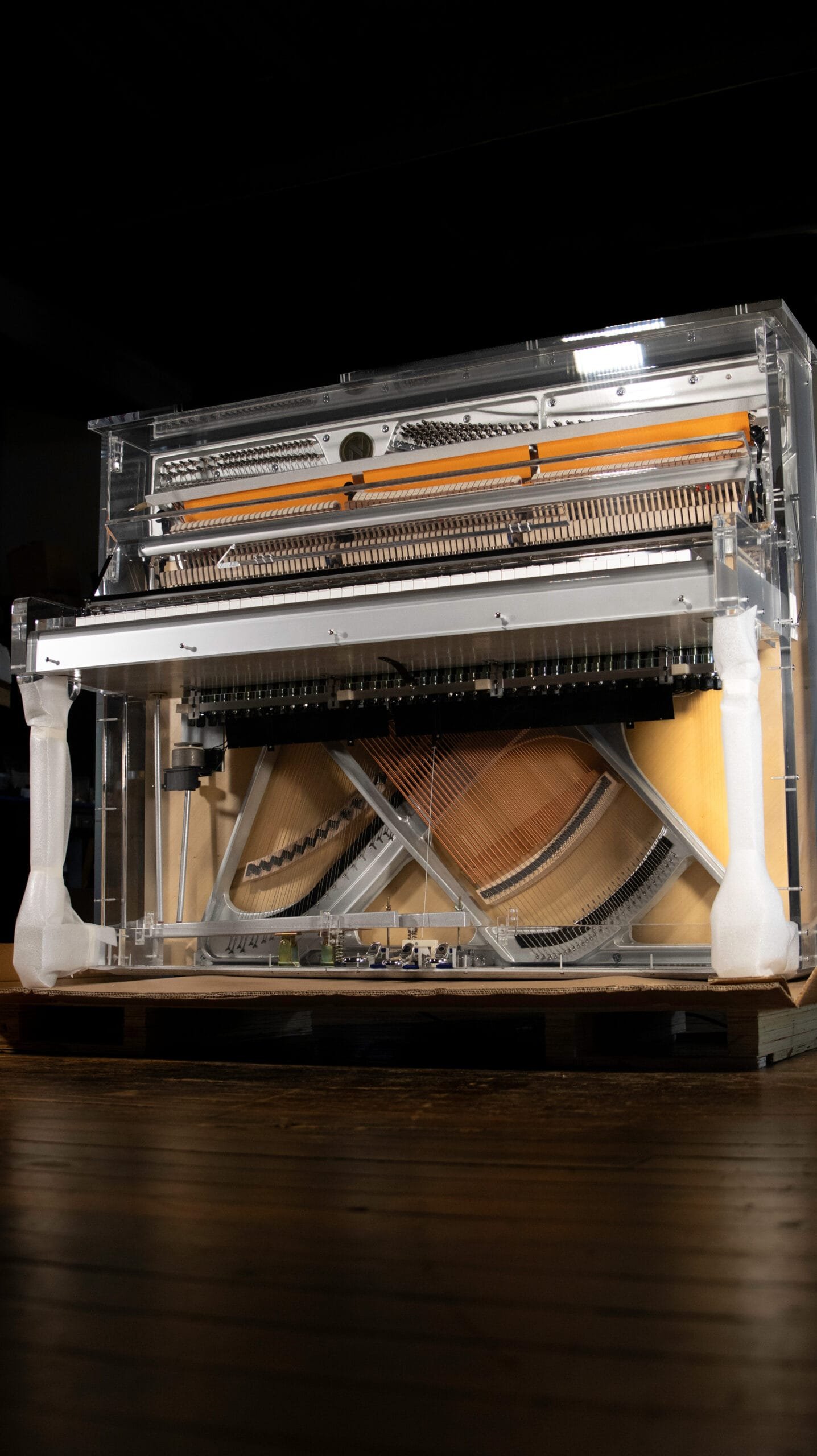 Transparent upright piano made of clear acrylic glass, Sonnova Crystal model.